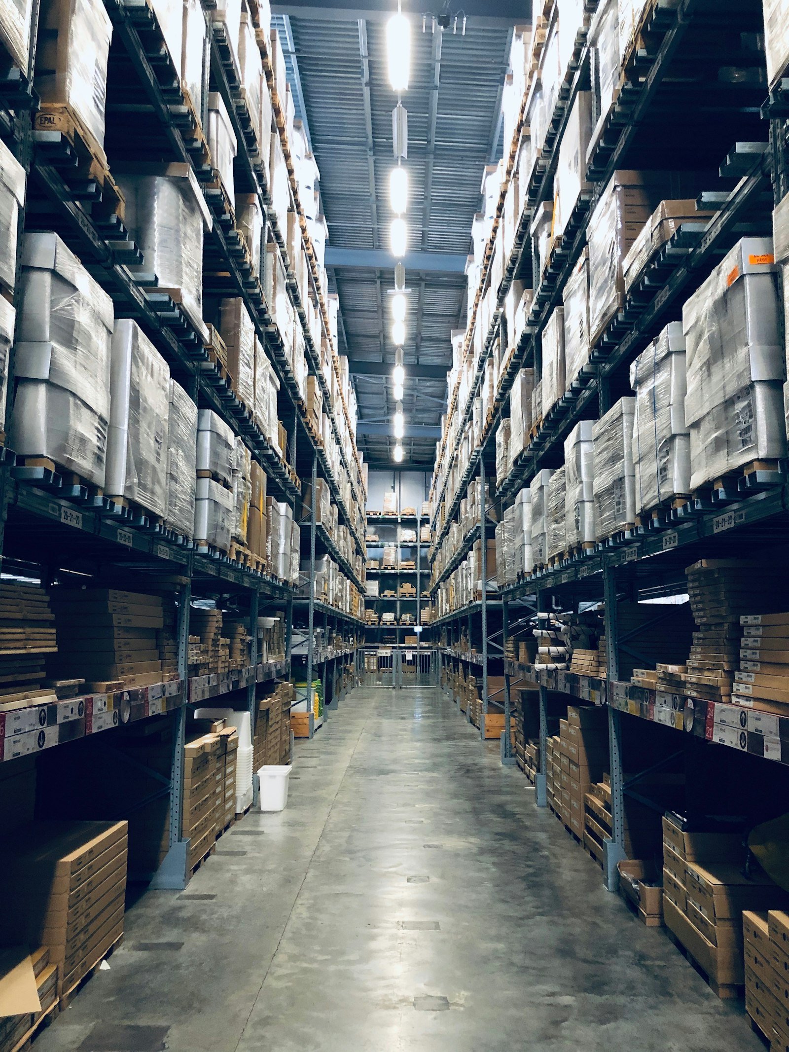 Warehouse aisle with stock shelves
